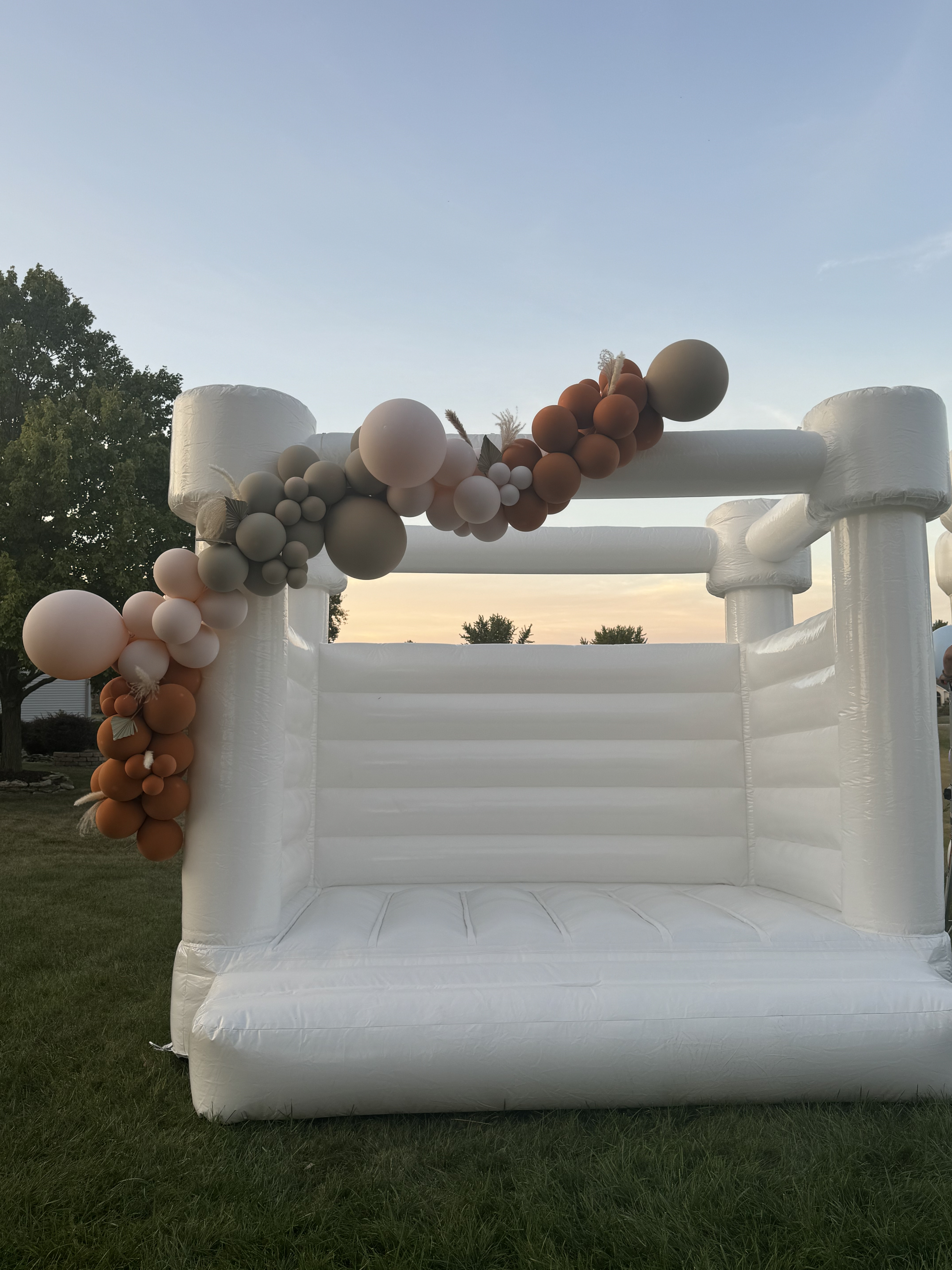 Luxury white bounce house rental styled for a shower in Allen County Indiana
